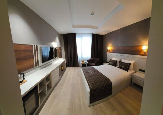 Imagen de la habitación del ROCCİA DOWNTOWN HOTEL. Foto 9