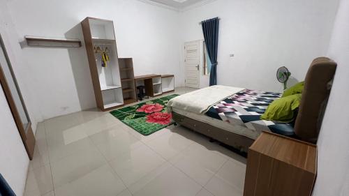 Imagen de la habitación del RUMAH 25 SYARIAH. Foto 20