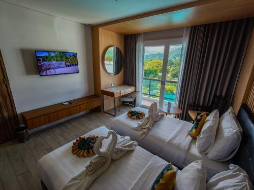 Imagen de la habitación del Raja Hotel Kuta Mandalika. Foto 17