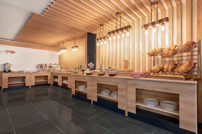 Imagen del bar/restaurante del Ramada By Wyndham Sivas. Foto 4