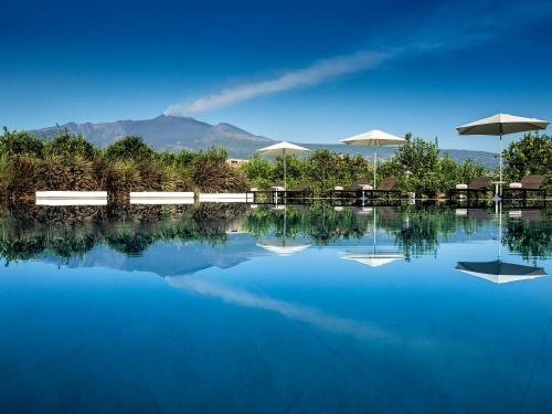Imagen de la piscina del Ramo D'aria Etna Boutique Hotel. Foto 9