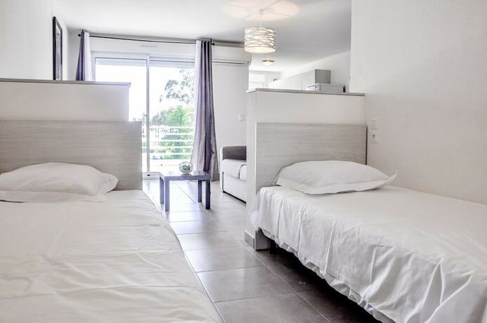 Imagen de la habitación del Résidence Pinarello. Foto 18