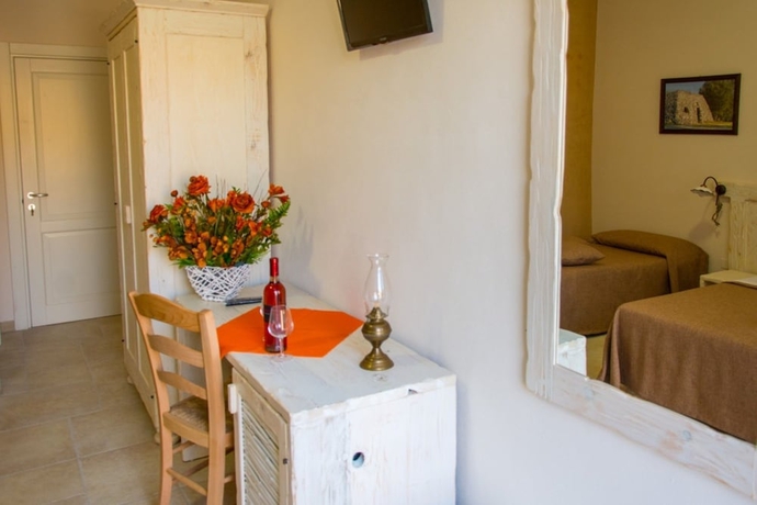 Imagen de la habitación del Relais Tenuta Camp&igrave;. Foto 2