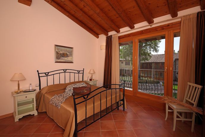 Imagen de la habitación del Residence Borgo Mondragon. Foto 2