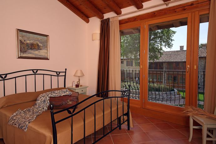 Imagen de la habitación del Residence Borgo Mondragon. Foto 12