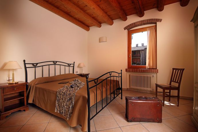 Imagen de la habitación del Residence Borgo Mondragon. Foto 16