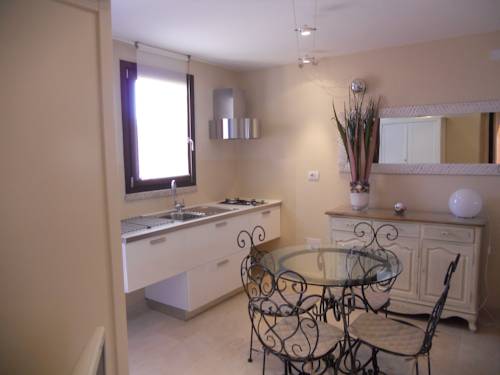 Imagen de la habitación del Residence Borgo Punta Villa. Foto 14