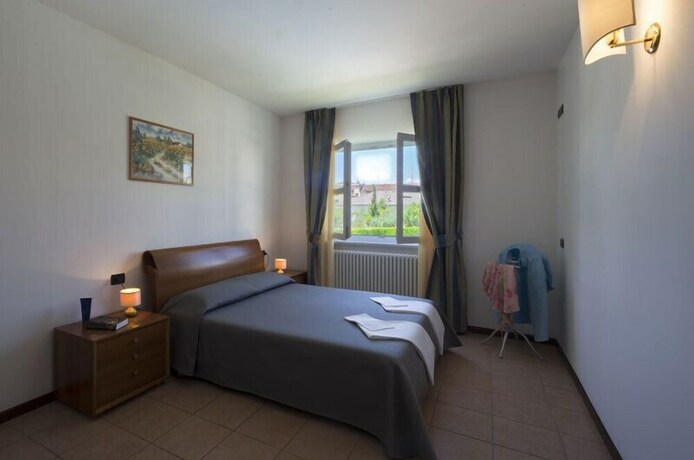 Imagen de la habitación del Residence Corte Delle Rose. Foto 17