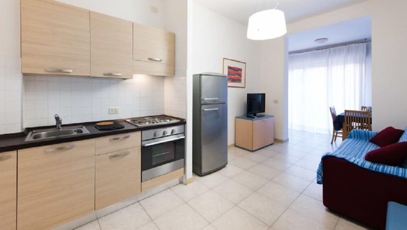 Imagen de la habitación del Residence La Rosa di Nettuno. Foto 13