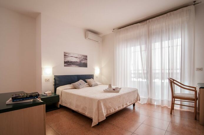 Imagen de la habitación del Residence La Rosa di Nettuno. Foto 18