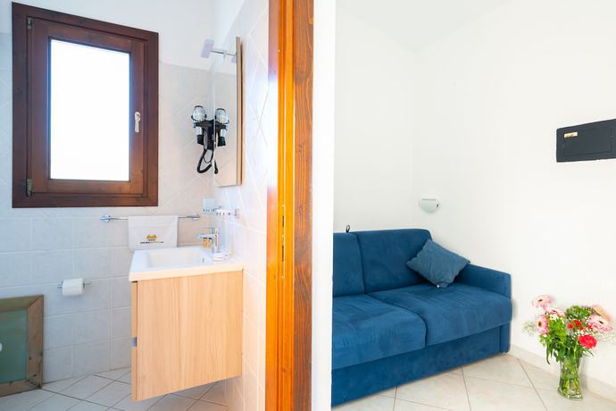 Imagen de la habitación del Residence Pendra Sardinia Costa del Turchese. Foto 2