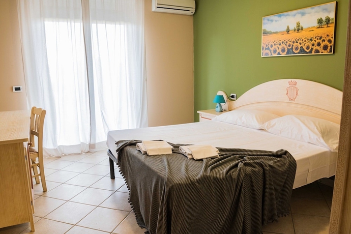 Imagen de la habitación del Residence Santa Costanza. Foto 14