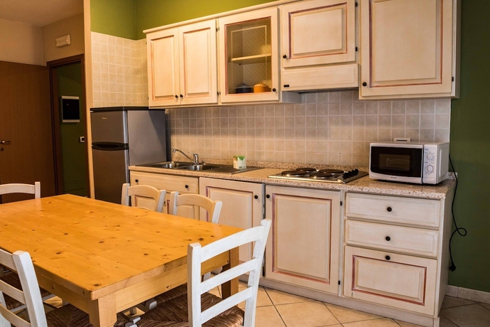 Imagen de la habitación del Residence Santa Costanza. Foto 17