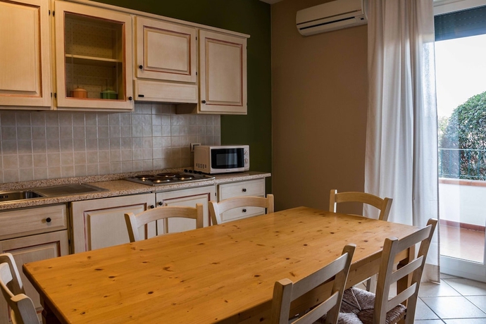 Imagen de la habitación del Residence Santa Costanza. Foto 18