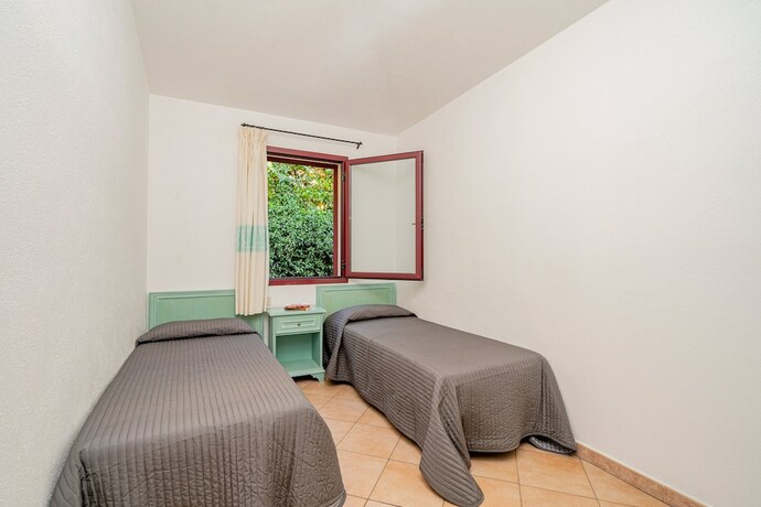 Imagen de la habitación del Residence with pool in Cala Girgolu. Foto 13