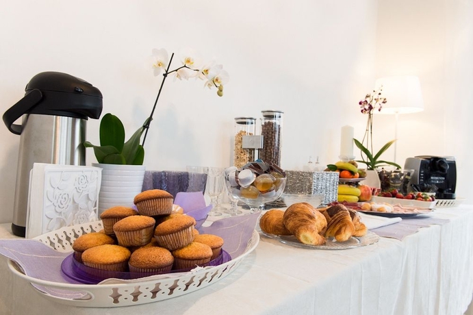 Imagen del bar/restaurante del Rome y Suites. Foto 3