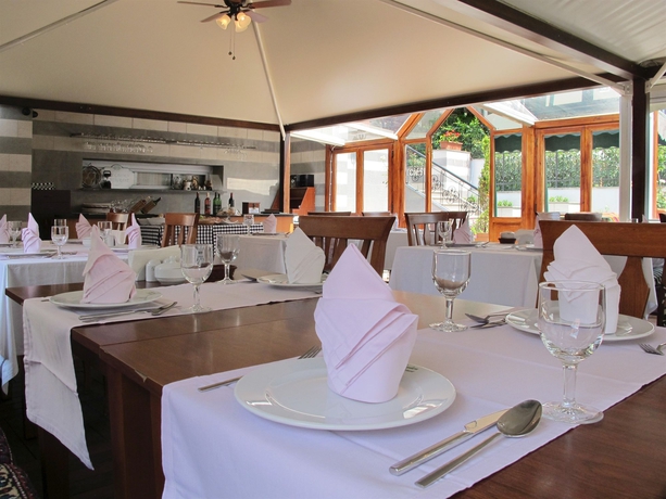 Imagen del bar/restaurante del Rose Garden Suites. Foto 5