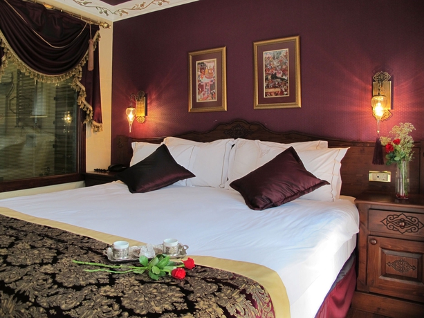 Imagen de la habitación del Rose Garden Suites. Foto 11