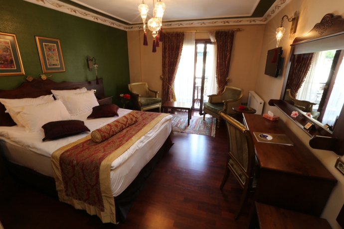 Imagen de la habitación del Rose Garden Suites. Foto 12