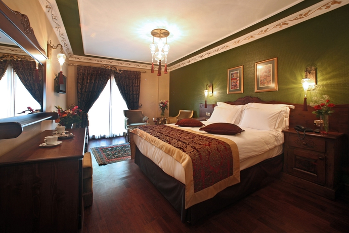 Imagen de la habitación del Rose Garden Suites. Foto 13