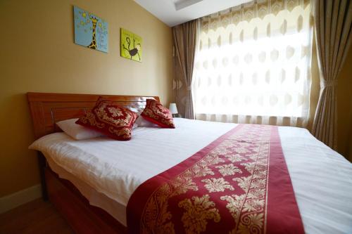 Imagen de la habitación del Rosy Town Holiday Apartment Changbai Mountain Ming. Foto 7