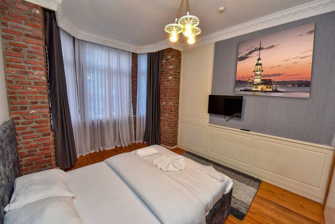 Imagen de la habitación del Royal Garden Suite Hotel. Foto 18