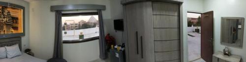 Imagen de la habitación del SAS pyramids view. Foto 17