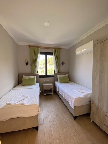 Imagen de la habitación del SUNA HOUSE. Foto 7