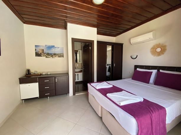 Imagen de la habitación del SUNA HOUSE. Foto 13