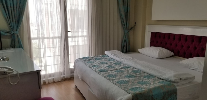 Imagen de la habitación del Sanli Hotel. Foto 11