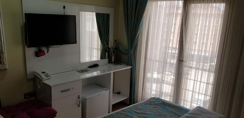 Imagen de la habitación del Sanli Hotel. Foto 14