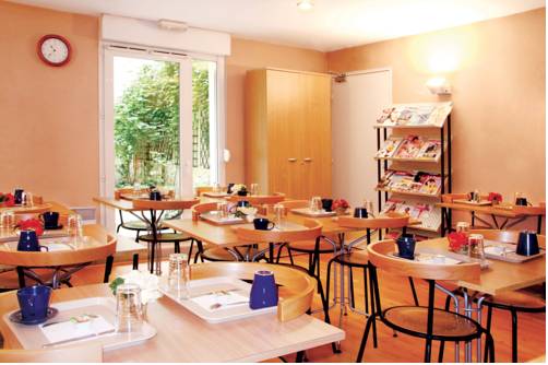 Imagen del bar/restaurante del Séjours and Affaires Pantin Charles De Gaulle. Foto 5