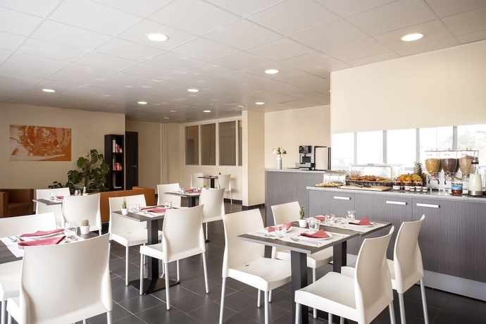 Imagen del bar/restaurante del S&eacute;jours and Affaires Paris Vincennes. Foto 4