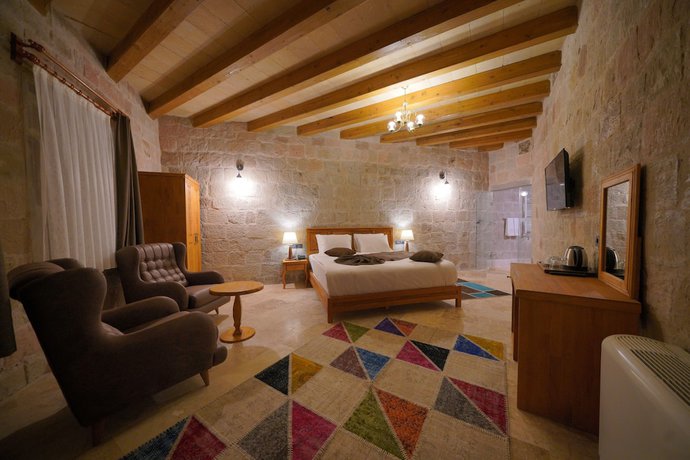 Imagen de la habitación del Secret Hill Cave Suites. Foto 17