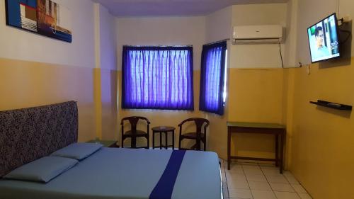 Imagen de la habitación del Sentosa Hotel & Restaurant - tersertifikasi CHSE dari Kementerian Pariwisata dan Ekonomi Kreatif. Foto 18
