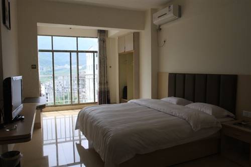 Imagen de la habitación del Shanshui Shishang Bama Bipoyuan Hotel. Foto 6