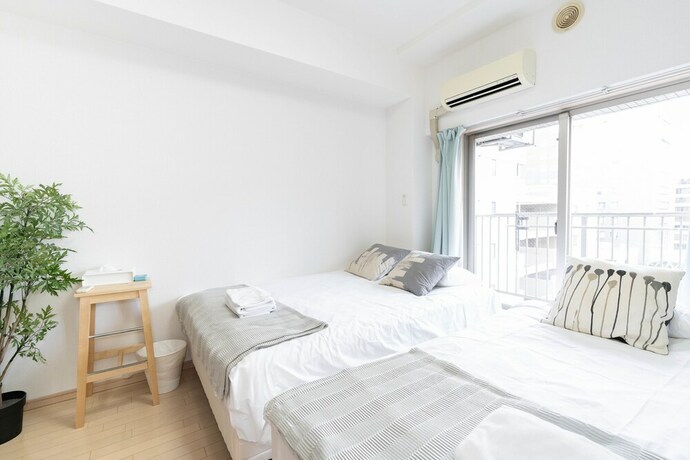 Imagen de la habitación del Shinsaibash East Nana Apartment &middot; Junan. Foto 17