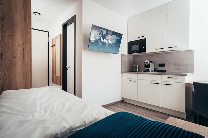 Imagen de la habitación del SmartLiving Apartments M&uuml;nchen. Foto 16