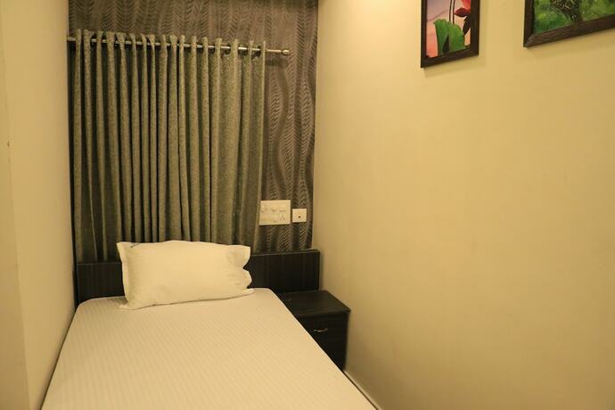 Imagen de la habitación del South Gate Residency. Foto 19