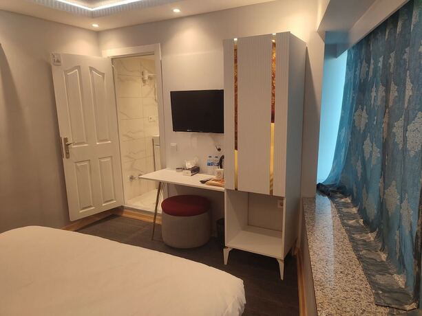 Imagen de la habitación del Stay Suite Hotel. Foto 16