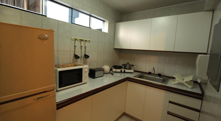 Imagen de la habitación del Suites Plaza Las Flores Aparthotel. Foto 6