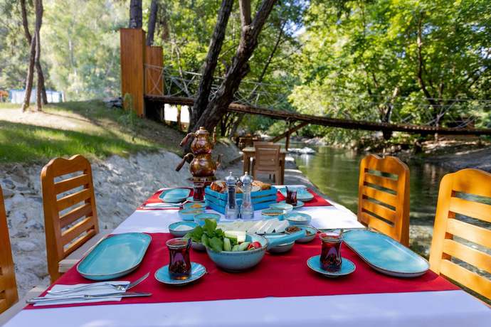 Imagen del bar/restaurante del Suna Village Hotel and Bungalow Fethiye. Foto 6