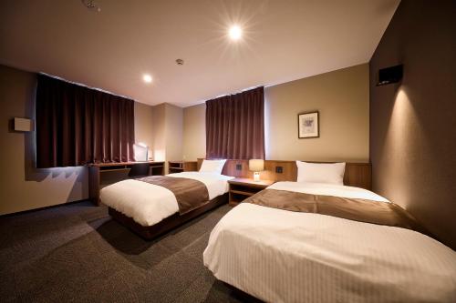 Imagen de la habitación del Sunnemu Hotel in Honjo. Foto 18