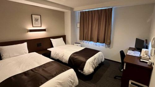 Imagen de la habitación del Sunnemu Hotel in Honjo. Foto 19