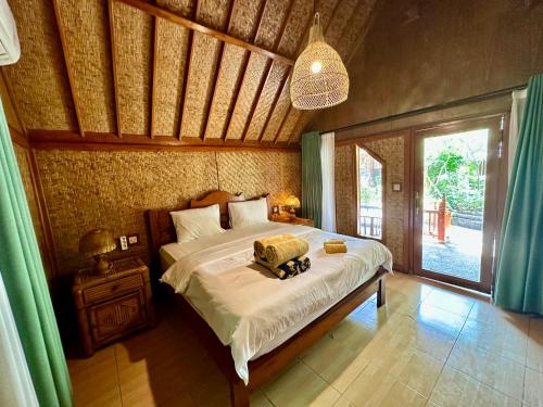 Imagen de la habitación del Sunny Rose Bungalows Gili Air. Foto 18