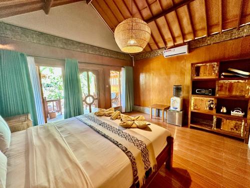 Imagen de la habitación del Sunny Rose Bungalows Gili Air. Foto 20