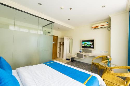 Imagen de la habitación del Super 8 Hotel Beihai Railway Station Branch. Foto 9