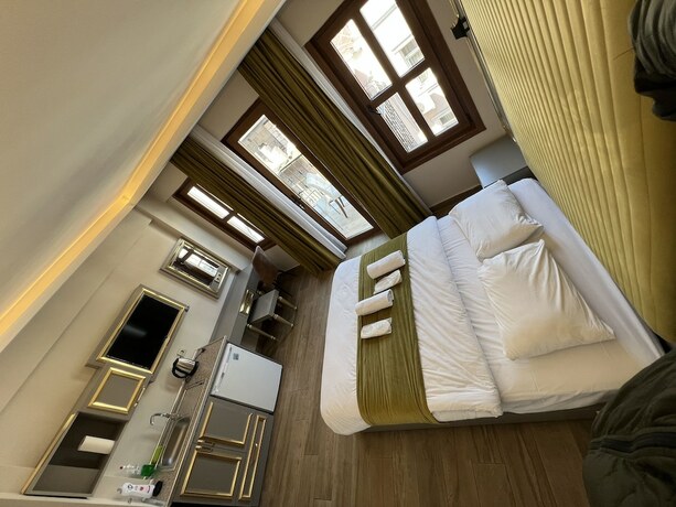Imagen de la habitación del Taksim La Marino Hotel. Foto 17
