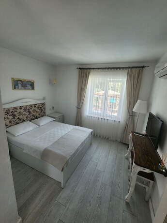 Imagen de la habitación del Tarcin Alacati Otel - Adults Only. Foto 17