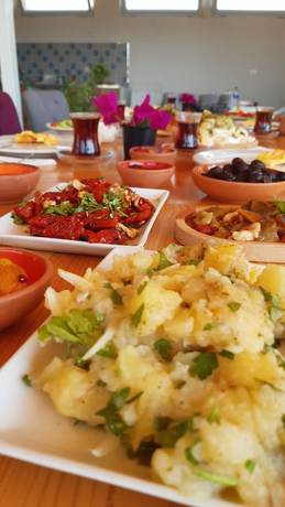Imagen del bar/restaurante del Tas Konak Butik Otel Bungalov. Foto 7